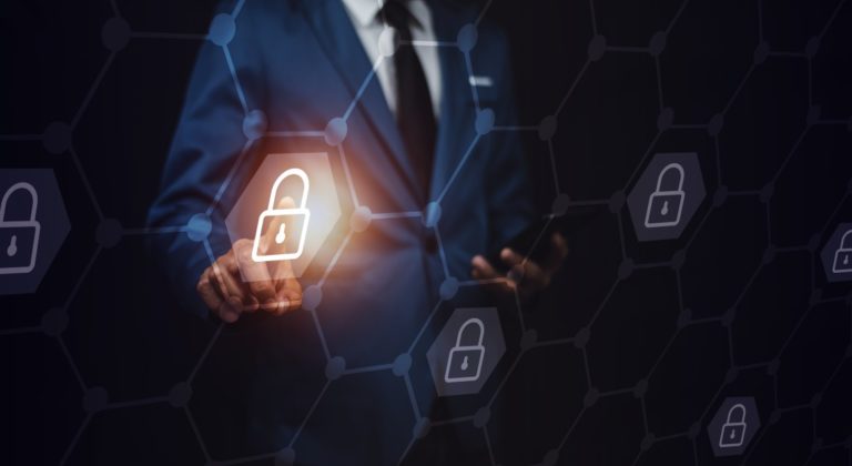 businessman unlocks screen with lock